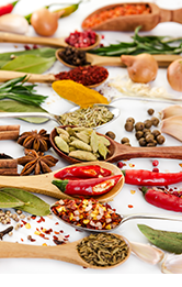 Different fragrant spices in spoons 